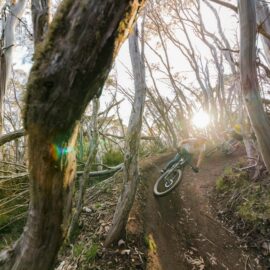 Cyclists riding berms at Mt Buller Bike Park